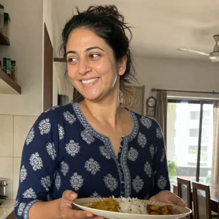 Priya serving a home-cooked meal